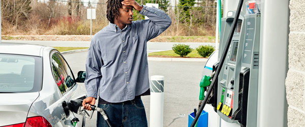 Customer Grimaces at Gas Prices
