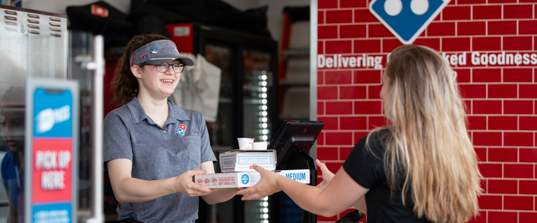 Customer Picking Up Domino's Pizza