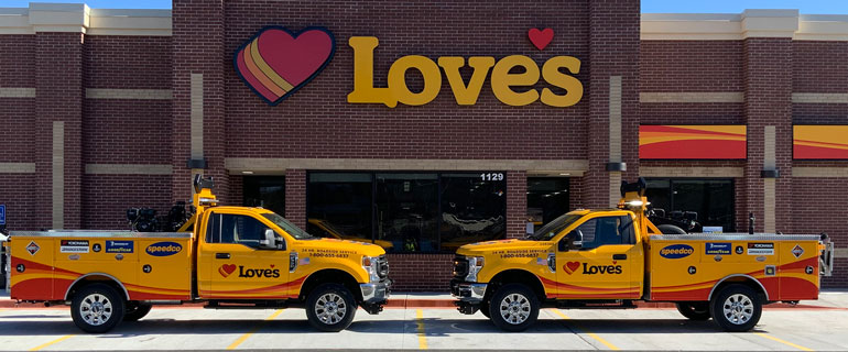 Two trucks outside of a Love's Convenience Store