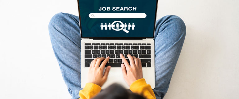 Person on computer to job search