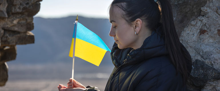 Woman Holds Ukrainian Flag