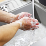 washes-hands-with-soap-under-the-tap.jpg